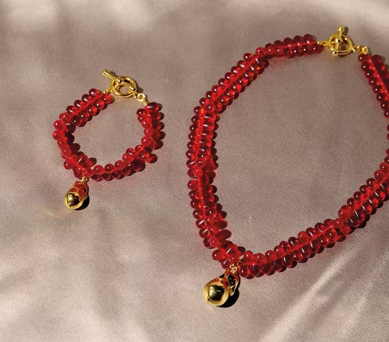 Fashion glass wide band bracelet with a gold teardrop pendant