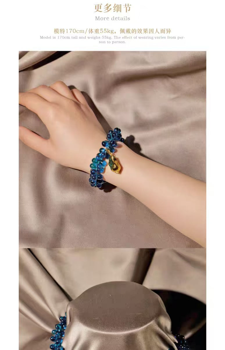 Fashion glass wide band bracelet with a gold teardrop pendant